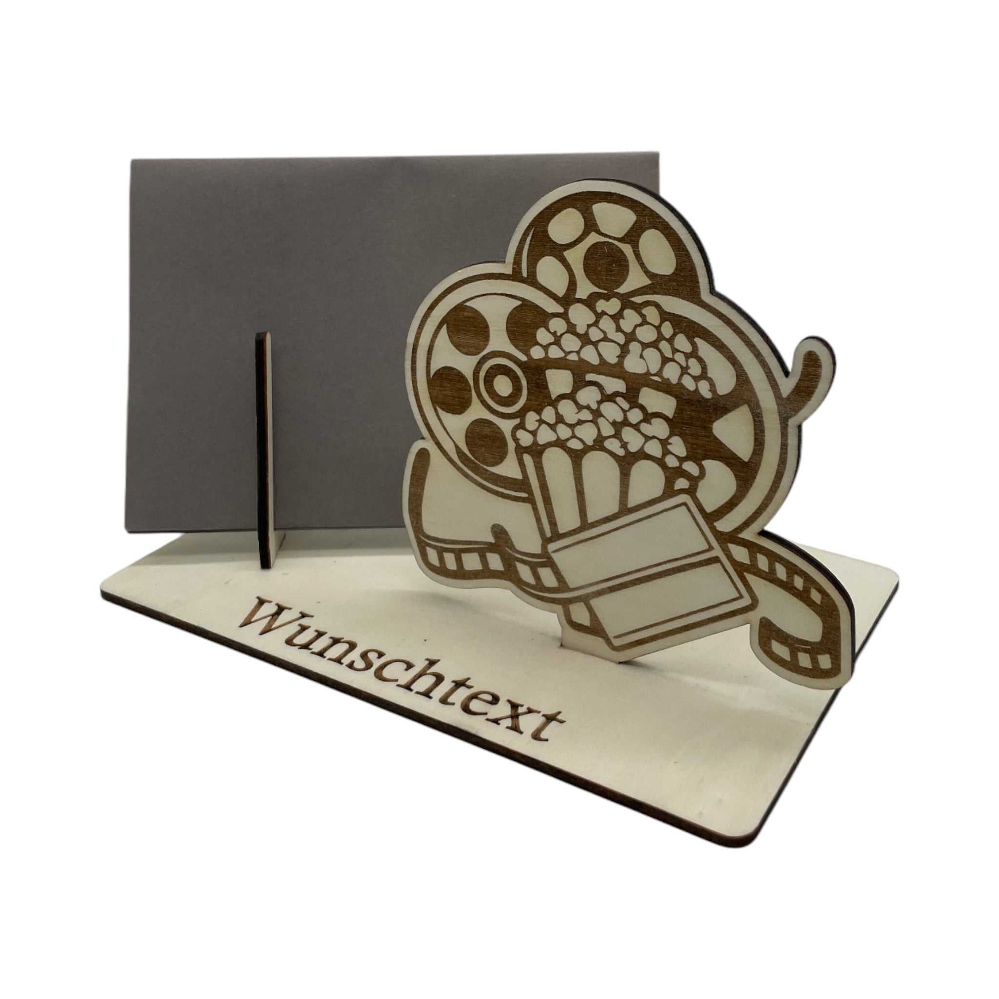 Gutschein verpacken für Filmfans: Holz-Gutscheinverpackung mit Filmrollen- und Popcorn-Motiv, ideal für Kinokarten oder Geldgeschenke, personalisierbar.